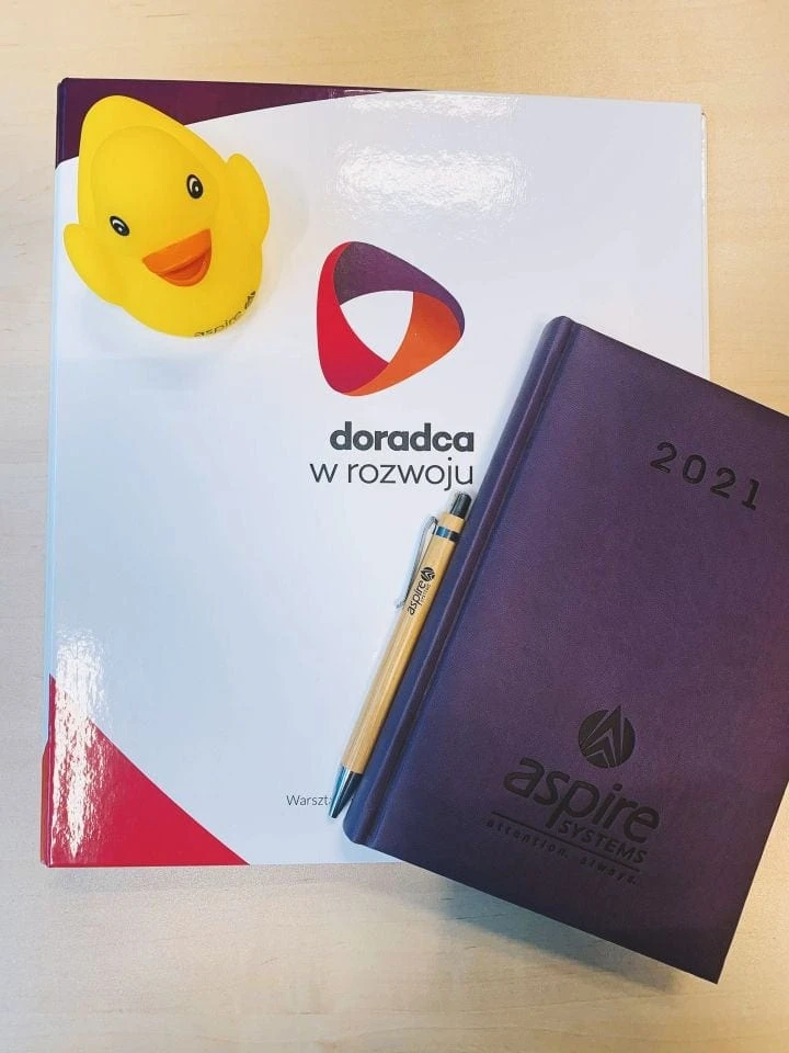 kalendarze z tłoczonym logo "aspire systems"